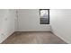 Bright, finished basement room with carpeted floor and window at 14100 E Temple Dr # W04, Aurora, CO 80015