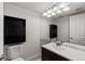Clean bathroom with single sink vanity and dark wood cabinets at 14100 E Temple Dr # W04, Aurora, CO 80015