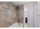 Bathroom with shower/tub combo and updated tile flooring at 14100 E Temple Dr # W04, Aurora, CO 80015
