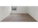 Bright bedroom with neutral carpeting and large window at 14100 E Temple Dr # W04, Aurora, CO 80015