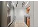 Kitchen featuring stainless steel refrigerator, track lighting, tile floor and granite counters at 14100 E Temple Dr # W04, Aurora, CO 80015