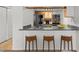 Well-equipped kitchen features a breakfast bar, stainless steel appliances, and granite countertops at 14100 E Temple Dr # W04, Aurora, CO 80015