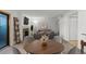 Cozy living room with a stone fireplace, modern furniture, and access to a private outdoor space at 14100 E Temple Dr # W04, Aurora, CO 80015