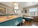 Elegant bathroom with double vanity and clawfoot tub at 47980 Monarch Cir, Parker, CO 80138