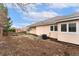 Backyard of home showing the yard and exterior of the house at 1904 S Union Pl, Lakewood, CO 80228
