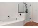Well-maintained bathroom features separate tub and shower with modern fixtures at 1904 S Union Pl, Lakewood, CO 80228