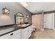 Rustic bathroom with a dark granite countertop and decorative lighting at 1904 S Union Pl, Lakewood, CO 80228