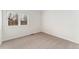 Neutral bedroom features a large window with shutter-style blinds at 1904 S Union Pl, Lakewood, CO 80228