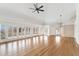 Bright living room with hardwood floors, vaulted ceilings, and many windows with shutter-style blinds at 1904 S Union Pl, Lakewood, CO 80228