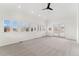 Expansive living room featuring neutral carpet, many windows and lots of natural light at 1904 S Union Pl, Lakewood, CO 80228