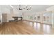 Spacious living room with a modern fireplace, hardwood flooring, and plenty of natural light at 1904 S Union Pl, Lakewood, CO 80228