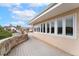 Curved patio with a stone wall overlooking the neighborhood at 1904 S Union Pl, Lakewood, CO 80228