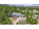Aerial view of a gray home nestled amongst trees and nature at 3640 Summertime Ct, Monument, CO 80132