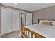 Comfortable bedroom featuring a wooden bed frame, closet and easy access to the laundry room at 3640 Summertime Ct, Monument, CO 80132