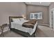 Neutral bedroom featuring a plush bed and bright window at 3640 Summertime Ct, Monument, CO 80132