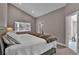 Bedroom showcasing a plush bed and easy access to the bathroom at 3640 Summertime Ct, Monument, CO 80132