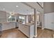 Open concept kitchen featuring a spacious island and a view of the dining room and outdoor deck at 3640 Summertime Ct, Monument, CO 80132