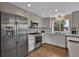 Contemporary kitchen featuring stainless steel appliances, light wood cabinetry and quartz countertops at 3640 Summertime Ct, Monument, CO 80132
