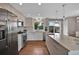 Contemporary kitchen featuring stainless steel appliances, light wood cabinetry and a spacious island at 3640 Summertime Ct, Monument, CO 80132