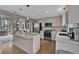 Open concept kitchen with a view of a deck, neutral cabinetry and stainless steel appliances at 3640 Summertime Ct, Monument, CO 80132