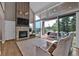 Bright living room with stone fireplace, vaulted ceilings, and sliding doors to deck at 3640 Summertime Ct, Monument, CO 80132
