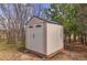 Outdoor storage shed with double doors and windows, sitting on a wooden base at 3640 Summertime Ct, Monument, CO 80132