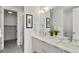 Bright bathroom featuring double sinks, contemporary fixtures, and a glass-enclosed shower at 1735 E 18Th Ave, Denver, CO 80218