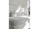 Bright bedroom with a large window and a comfortable bed with a 'Sunshine on my mind' pillow at 1735 E 18Th Ave, Denver, CO 80218