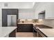 Modern kitchen featuring sleek white and wood cabinets, stainless steel appliances, and stylish countertop decor at 1735 E 18Th Ave, Denver, CO 80218