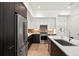 Contemporary kitchen featuring a large island, modern cabinetry, stainless steel appliances, and wood flooring at 1735 E 18Th Ave, Denver, CO 80218