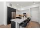Bright kitchen with large island, modern cabinetry, stainless steel appliances, and seating for three at 1735 E 18Th Ave, Denver, CO 80218
