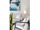Close-up of a cozy living space with neutral tones, stylish seating, and a modern art piece at 1735 E 18Th Ave, Denver, CO 80218