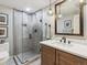 Bathroom featuring a glass walk-in shower with sleek tiling and a vanity with a modern sink and mirror at 1111 Race St # 3A, Denver, CO 80206