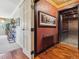 Hallway featuring hardwood floors, fresh paint, and an elevator at 1111 Race St # 3A, Denver, CO 80206