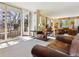Bright living room with private balcony access offering outdoor views at 1111 Race St # 3A, Denver, CO 80206