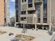 Outdoor patio with barbecue, seating area, and views of the building's architectural design at 1111 Race St # 3A, Denver, CO 80206