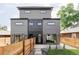 Contemporary home featuring a fenced backyard with a patio and fresh lawn at 4481 Raleigh St, Denver, CO 80211