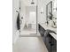 Modern bathroom with a soaking tub, walk-in shower, dual vanity, and sleek fixtures at 4481 Raleigh St, Denver, CO 80211