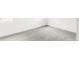 Empty room with neutral carpet and white walls, ready for customization at 4481 Raleigh St, Denver, CO 80211