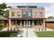 Charming brick home with a modern design and inviting front yard landscaping at 4481 Raleigh St, Denver, CO 80211