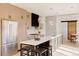 Contemporary kitchen with light wood cabinets and a large island with seating at 4481 Raleigh St, Denver, CO 80211