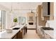 Bright, spacious kitchen featuring a large island and stainless steel appliances at 4481 Raleigh St, Denver, CO 80211