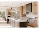 Stunning kitchen with modern cabinets, stainless steel appliances, and a center island at 4481 Raleigh St, Denver, CO 80211
