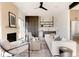 Inviting living room with a fireplace, modern furnishings, and ample natural light at 4481 Raleigh St, Denver, CO 80211