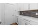 Modern pantry with white cabinets and quartz countertops at 2947 S Elati St, Englewood, CO 80110