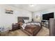 A comfortable bedroom featuring natural light, neutral tones, and tasteful decor create a cozy retreat at 18366 E 102Nd Pl, Commerce City, CO 80022