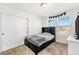 Cozy bedroom featuring a comfortable bed, natural light, and ample closet space for optimal organization at 18366 E 102Nd Pl, Commerce City, CO 80022