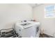 Functional laundry room with modern appliances and ample natural light creates an efficient space at 18366 E 102Nd Pl, Commerce City, CO 80022