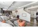Open concept living space with a modern kitchen, comfortable seating and natural light at 18366 E 102Nd Pl, Commerce City, CO 80022