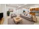 Finished basement featuring a wet bar, comfortable seating, and ample space for entertaining at 14032 E Chenango Dr, Aurora, CO 80015